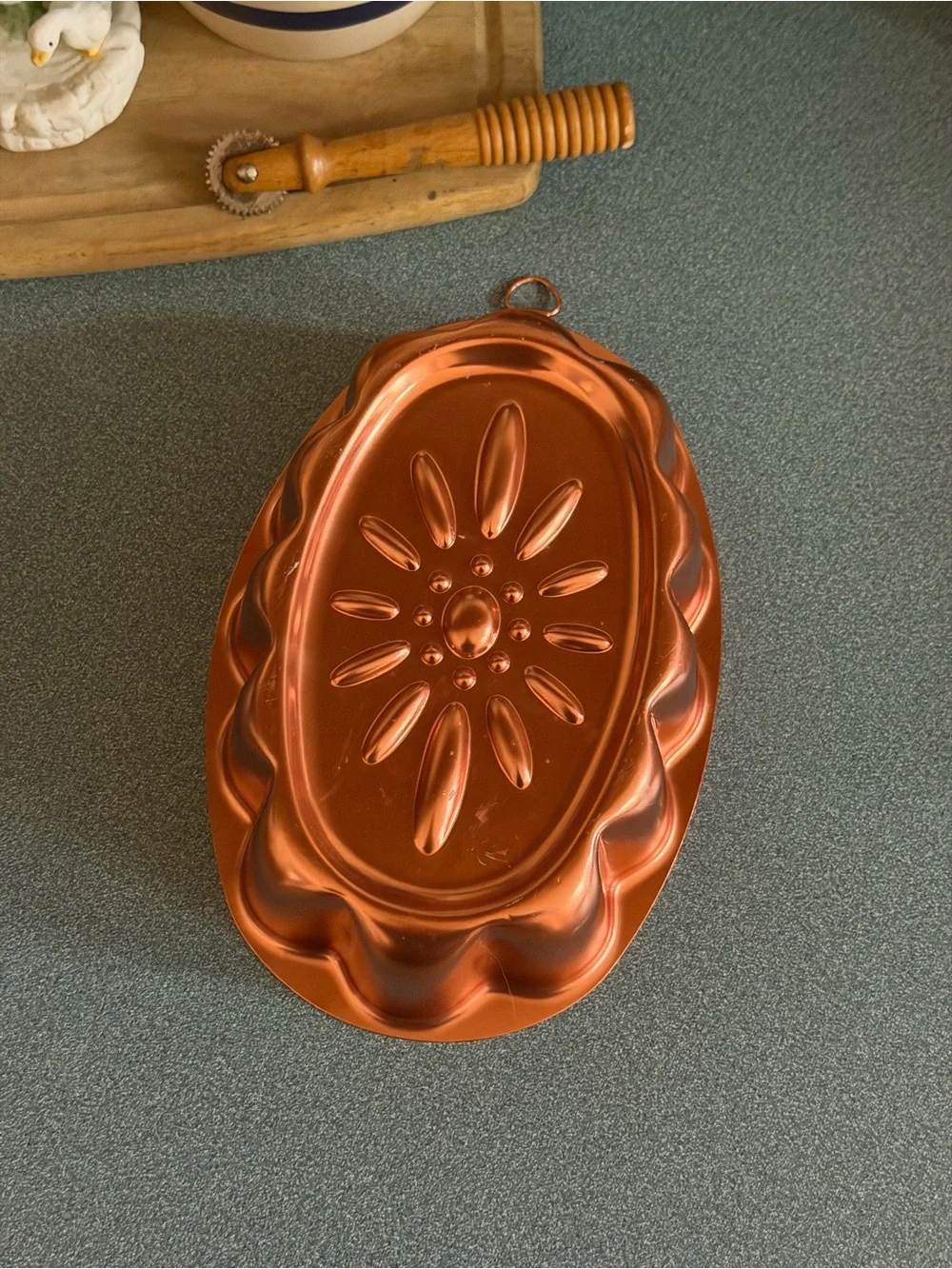 Vintage copper-colored aluminum daisy pattern mold